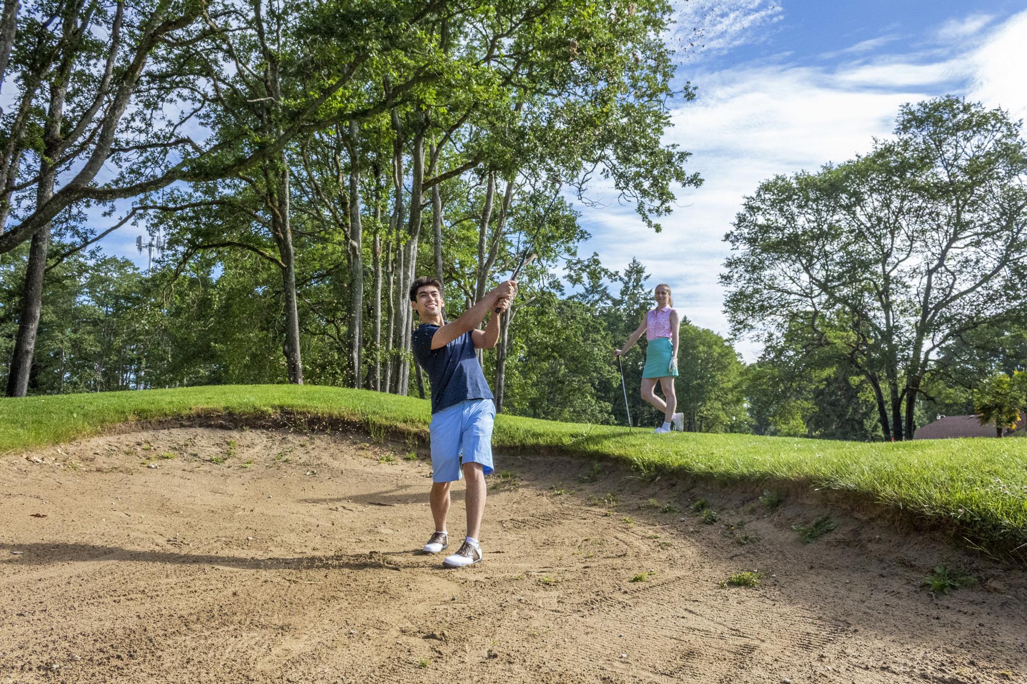 Young man golfing at Oakbrook Golf Club