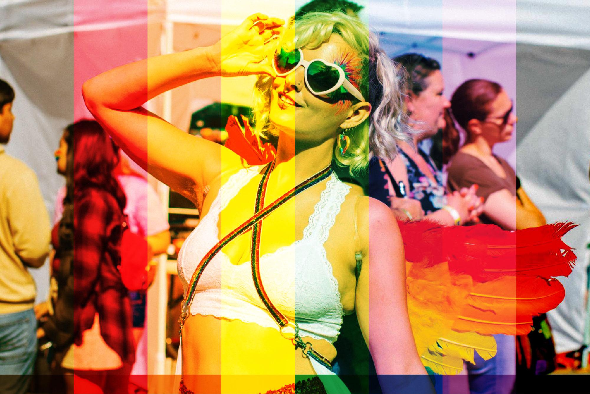 Woman at Tacoma Pride with rainbow wings